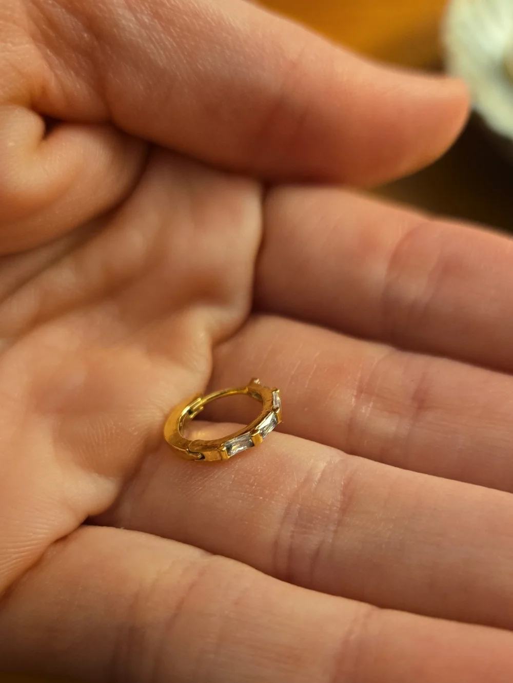 Gold Colored Hoop Huggie Earrings with Clear Stones